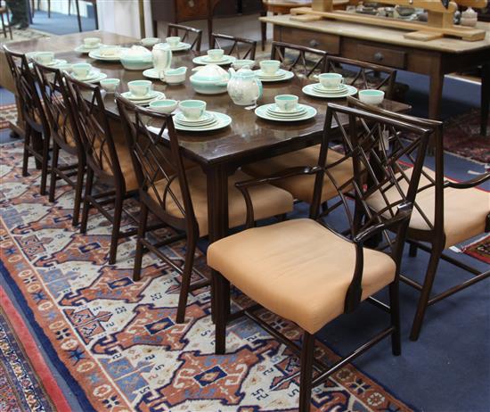 A mid to late 20th century mahogany extending dining table and ten chairs, extends to 7ft 7in. x 3ft 6in. H.2ft 5in.